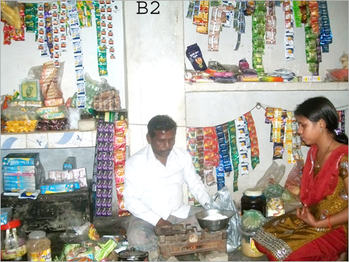 Ram Lakhan selling sugar to a woman